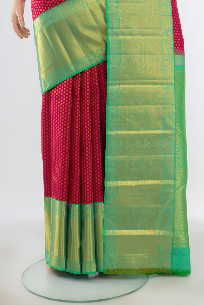 Pleats and pallu of Dark Pink Kanjivaram Silk Saree with Plain Body and Silk Border. 