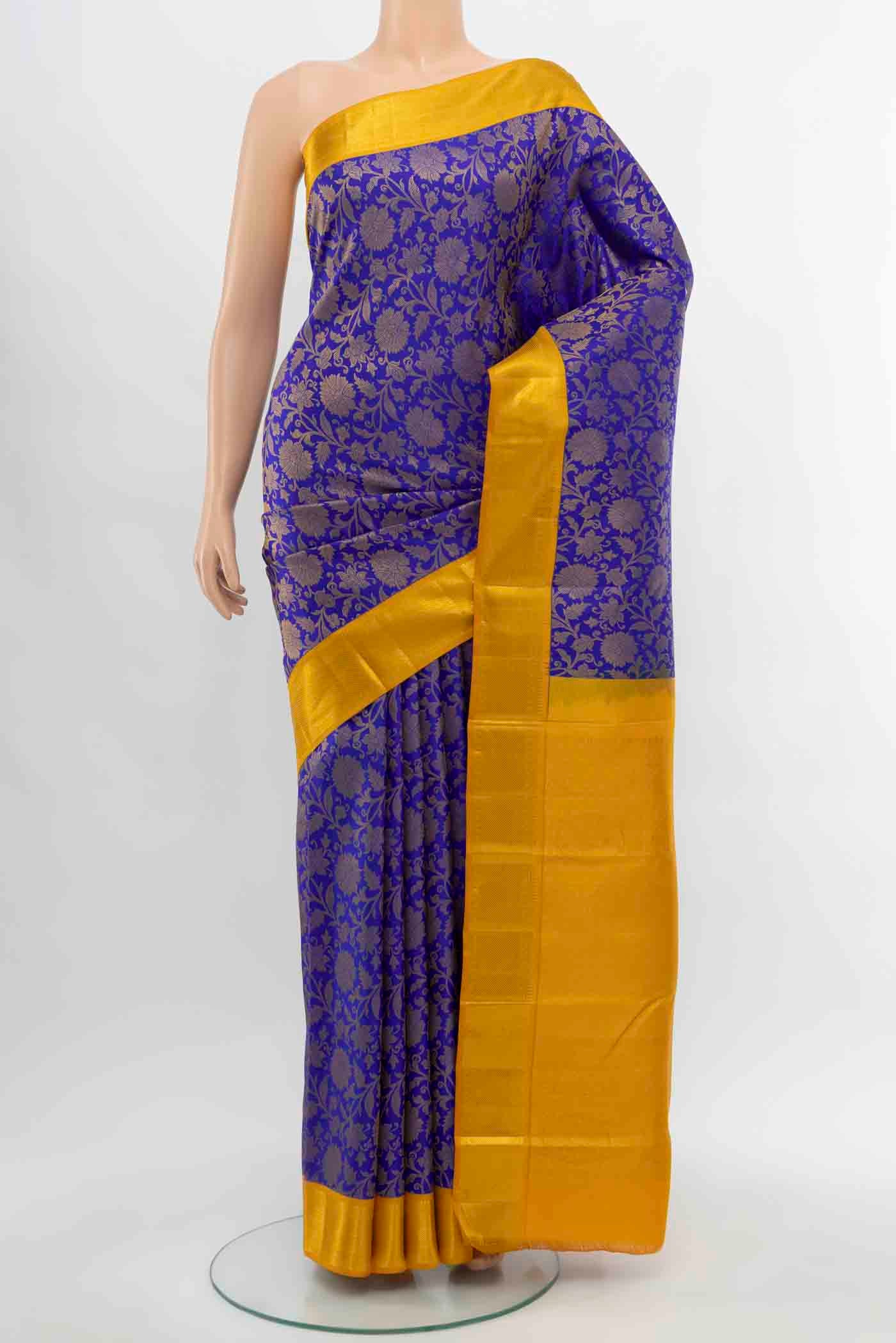 Dark Blue Kanjivaram Silk Saree with Zari Butta on the body and Silk Border.  displayed on a mannequin