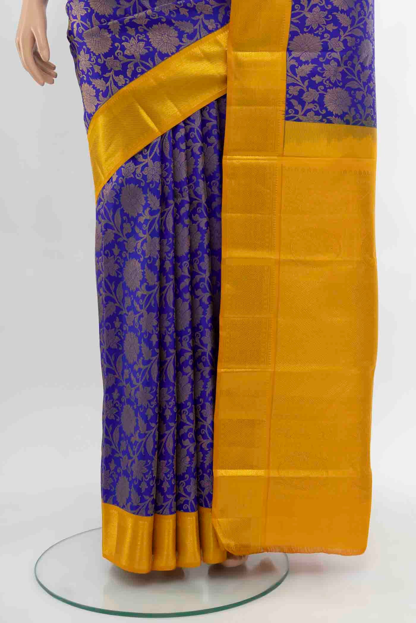 Pleats and pallu of Dark Blue Kanjivaram Silk Saree with Zari Butta on the body and Silk Border. 
