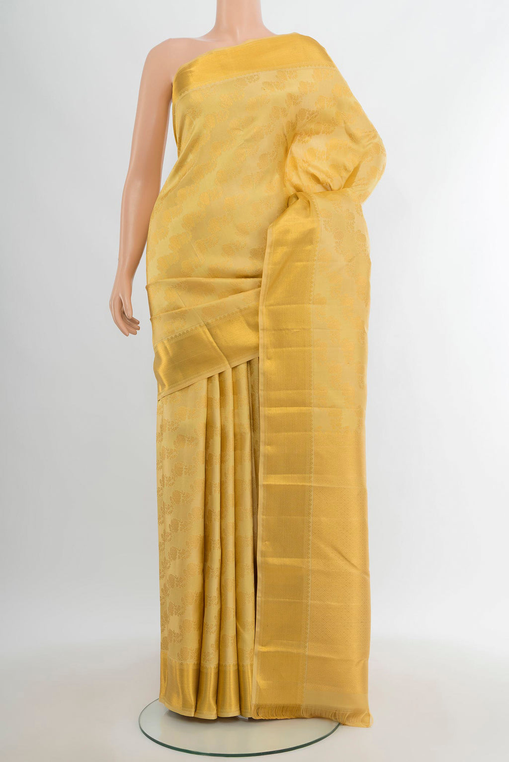 Sandal Kanjivaram Silk Saree with Zari Brocade on the body and Zari Border.  displayed on a mannequin