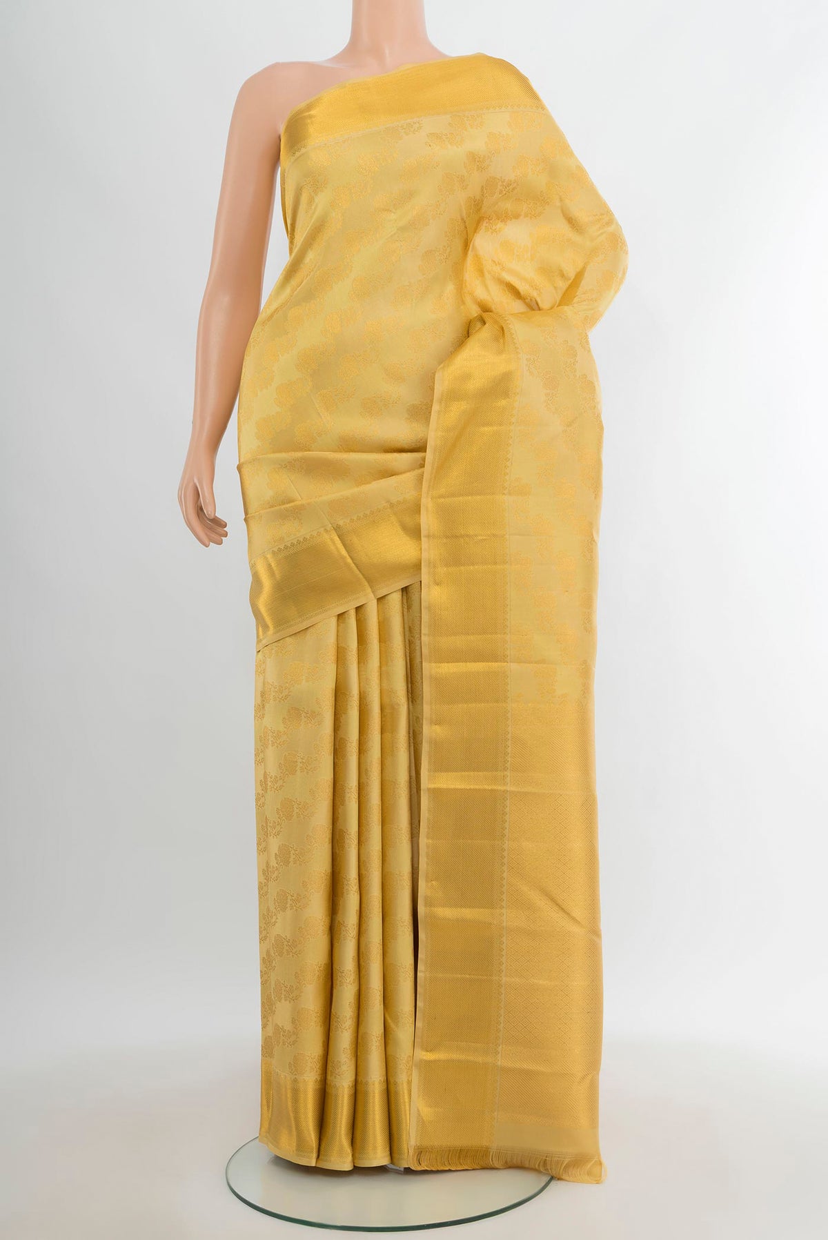 Sandal Kanjivaram Silk Saree with Zari Brocade on the body and Zari Border.  displayed on a mannequin