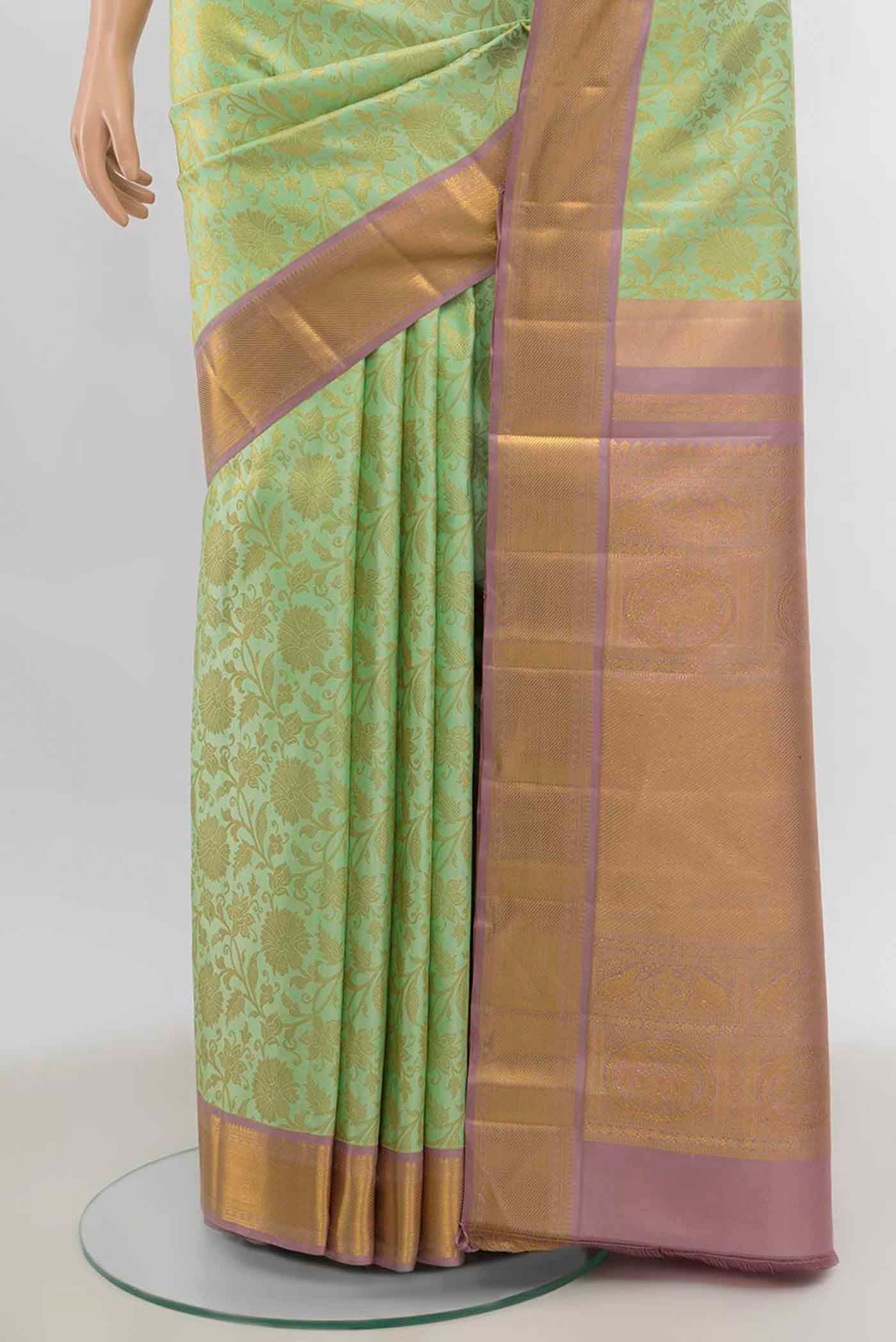 Pleats and pallu of Pista Green Kanchipuram Silk Saree with Zari Brocade on the body and Zari Border