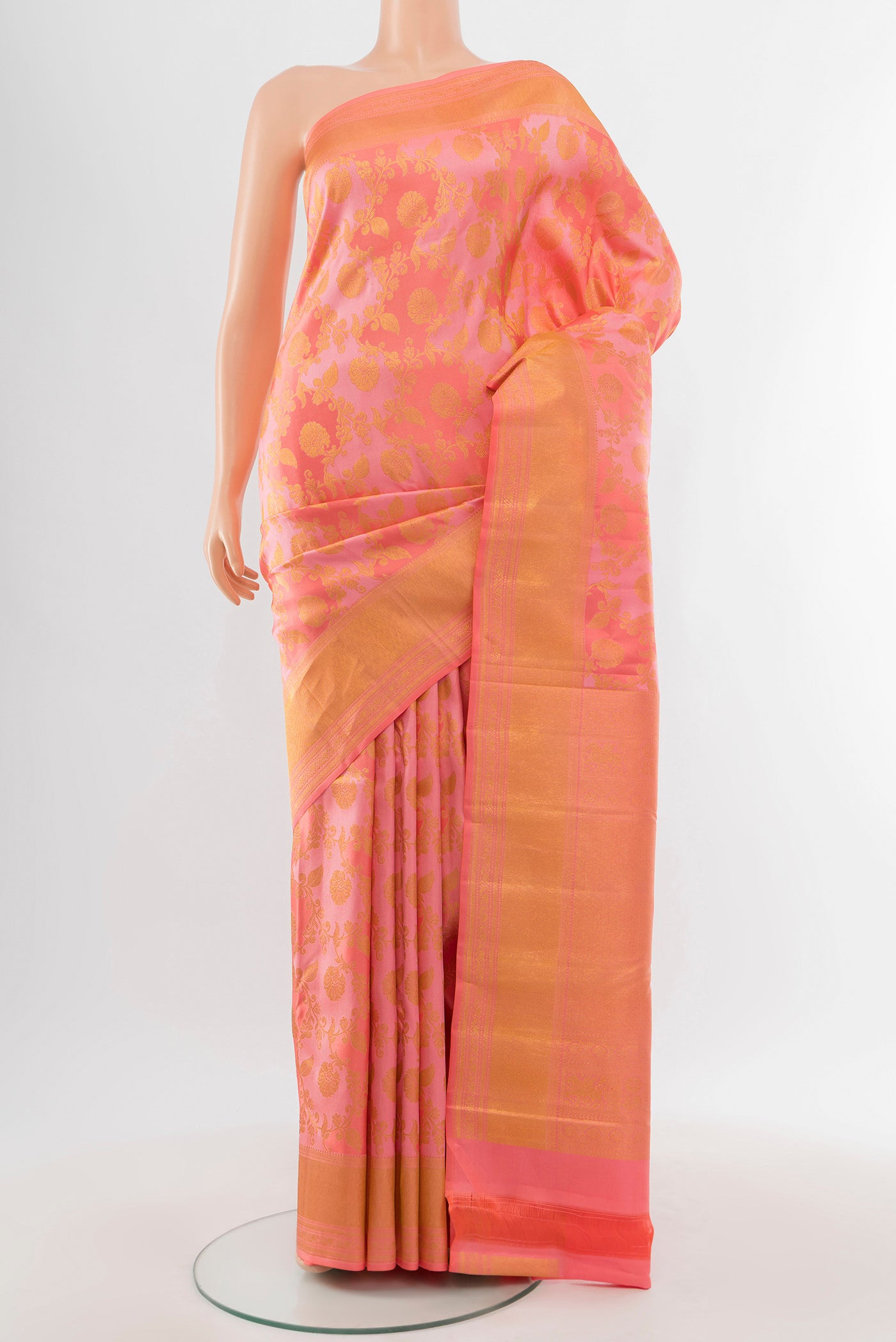 Pure Silk Pure Zari Rose Gold Kanjivaram Saree with Zari Butta on the body and Silk Border.  displayed on a mannequin