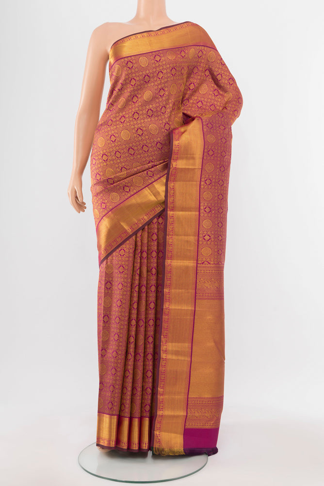 Dark Pink Kanjivaram Silk Saree with Zari Butta on the body and Silk Border.  displayed on a mannequin