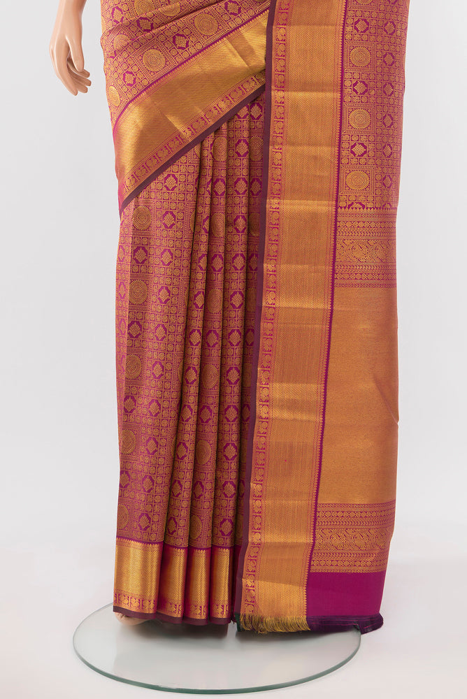 Pleats and pallu of Dark Pink Kanjivaram Silk Saree with Zari Butta on the body and Silk Border. 