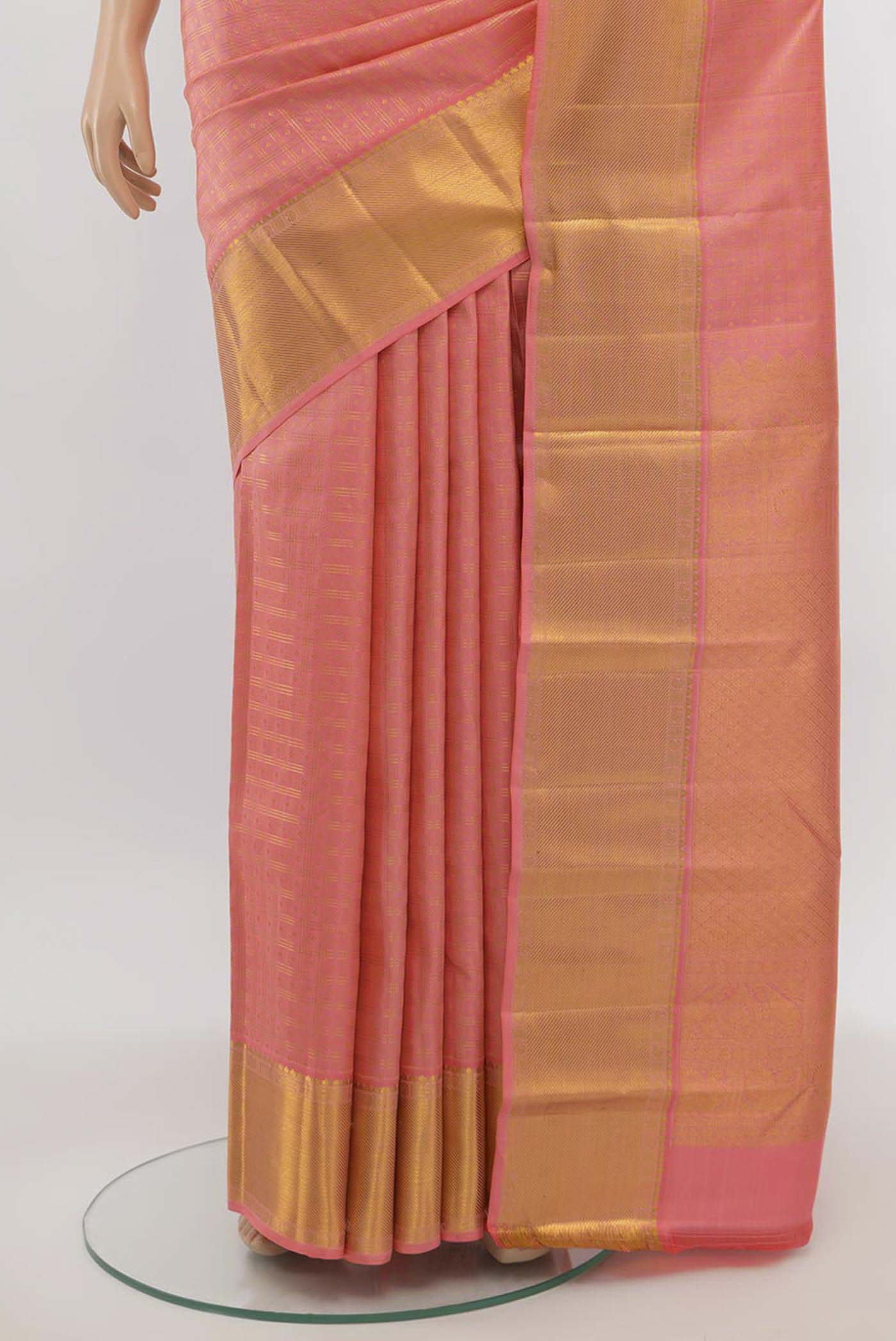 Pleats and pallu of Rose Gold Kanjivaram Silk Saree with Zari Butta on the body and Silk Border. 