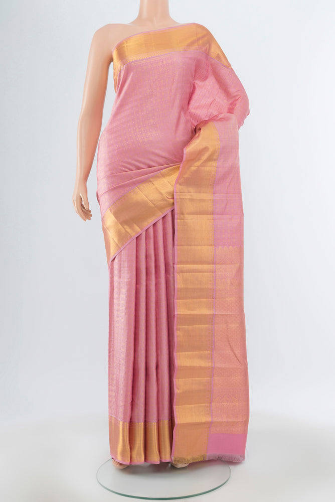 Rose pink Kanjivaram Silk Saree with Zari Butta on the body and Silk Border.  displayed on a mannequin