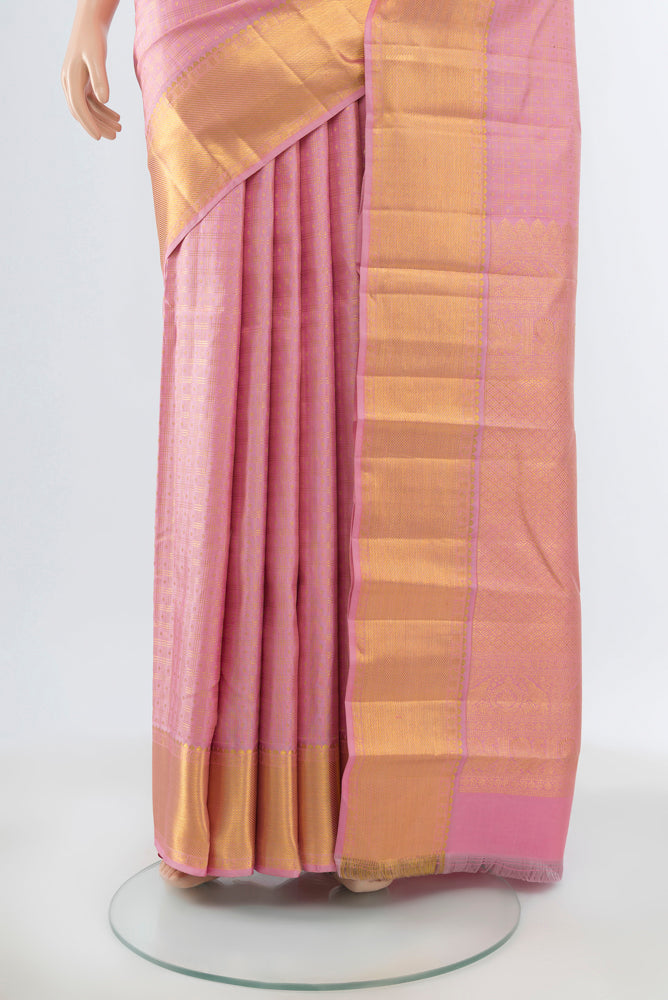 Pleats and pallu of Rose pink Kanjivaram Silk Saree with Zari Butta on the body and Silk Border. 