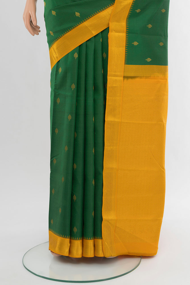 Pleats and pallu of Pure Silk Pure Zari Mint Green Kanchipuram Saree with Zari Butta on the body and Silk Border. 