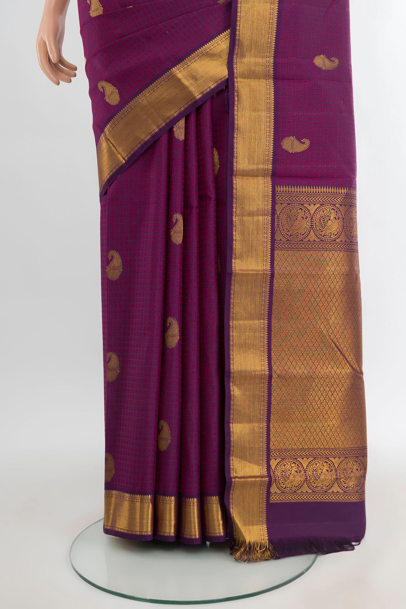Pleats and pallu of Purple Kanchipuram Silk Saree with Jacquard With Zari Butta on the body and Zari Border. 