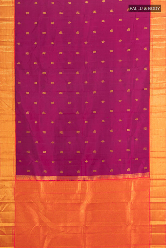 Flat view of Magenta Kanchipuram Silk Saree with Zari Butta on the body and Silk Border. 