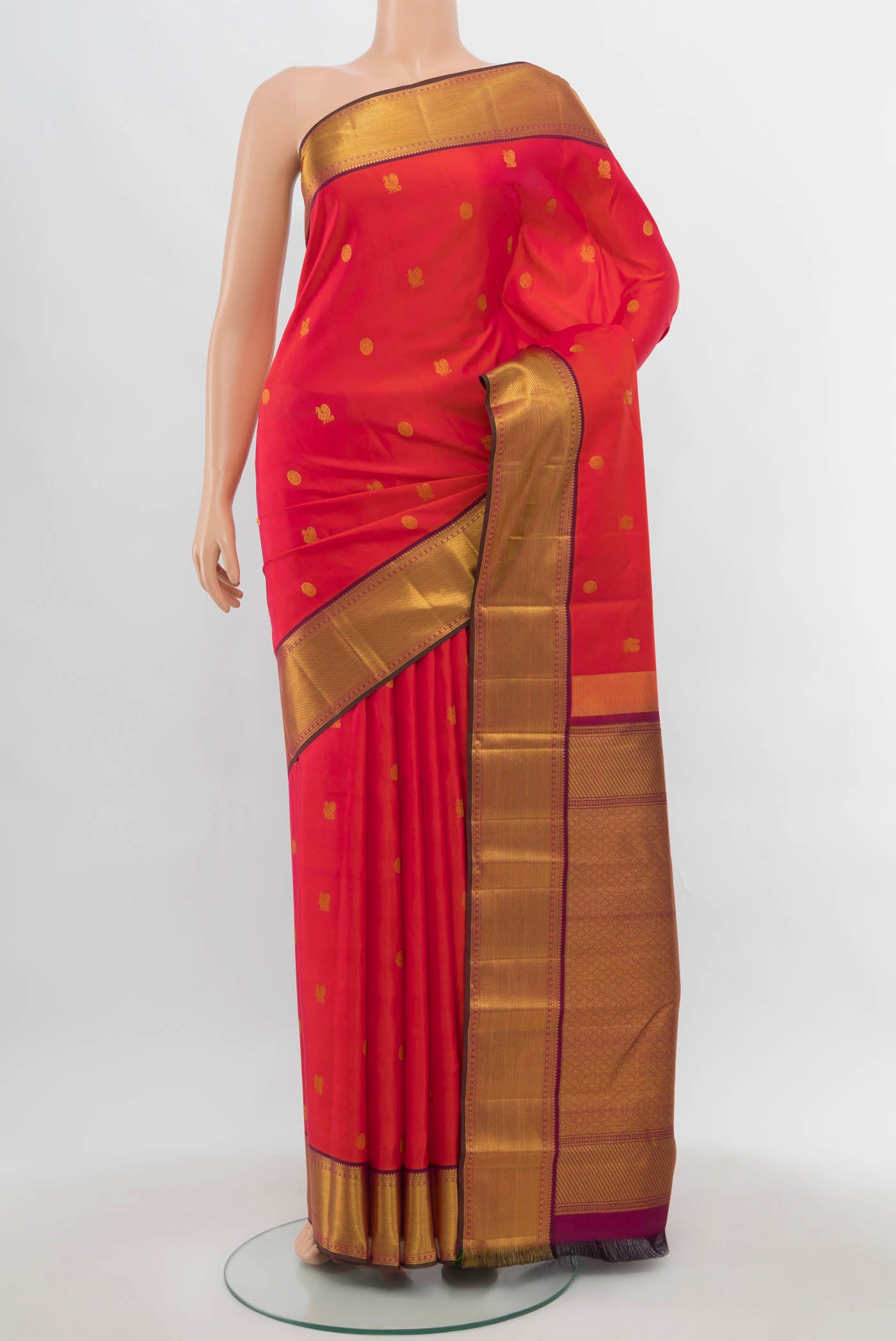 Imperial Pink Kanchipuram Silk Saree with Zari Butta on the body and Silk Border.  displayed on a mannequin