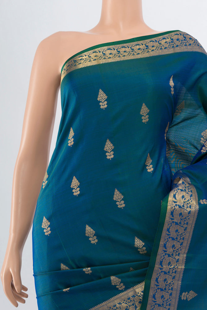 Border image of Peacock Blue Kanjivaram Silk Saree with Zari Butta on the body and Silk Border. 