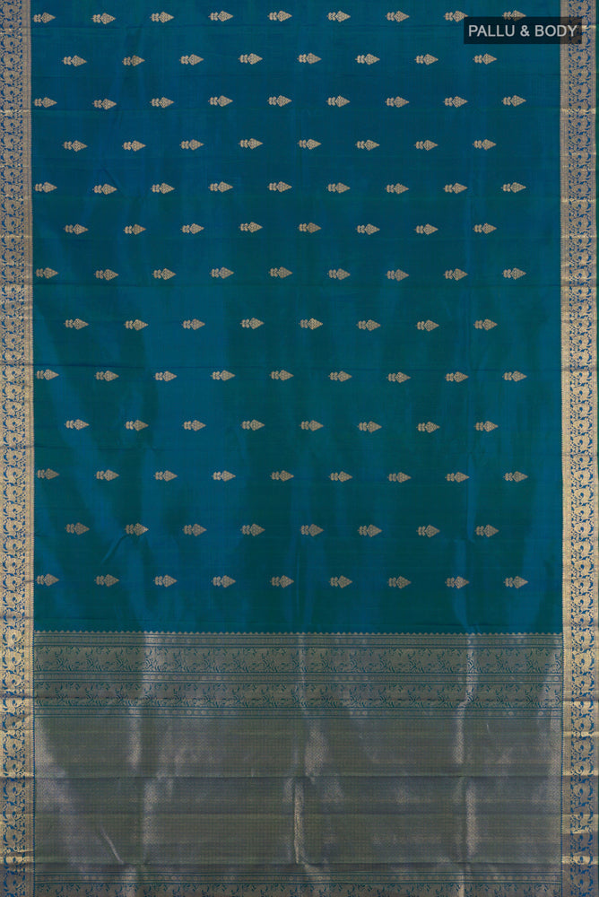 Flat view of Peacock Blue Kanjivaram Silk Saree with Zari Butta on the body and Silk Border. 