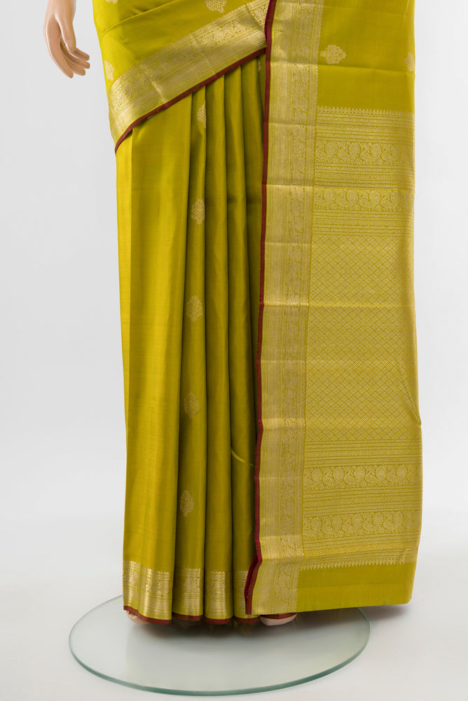 Pleats and pallu of Light Green Kanjivaram Silk Saree with Zari Butta on the body and Silk Border. 