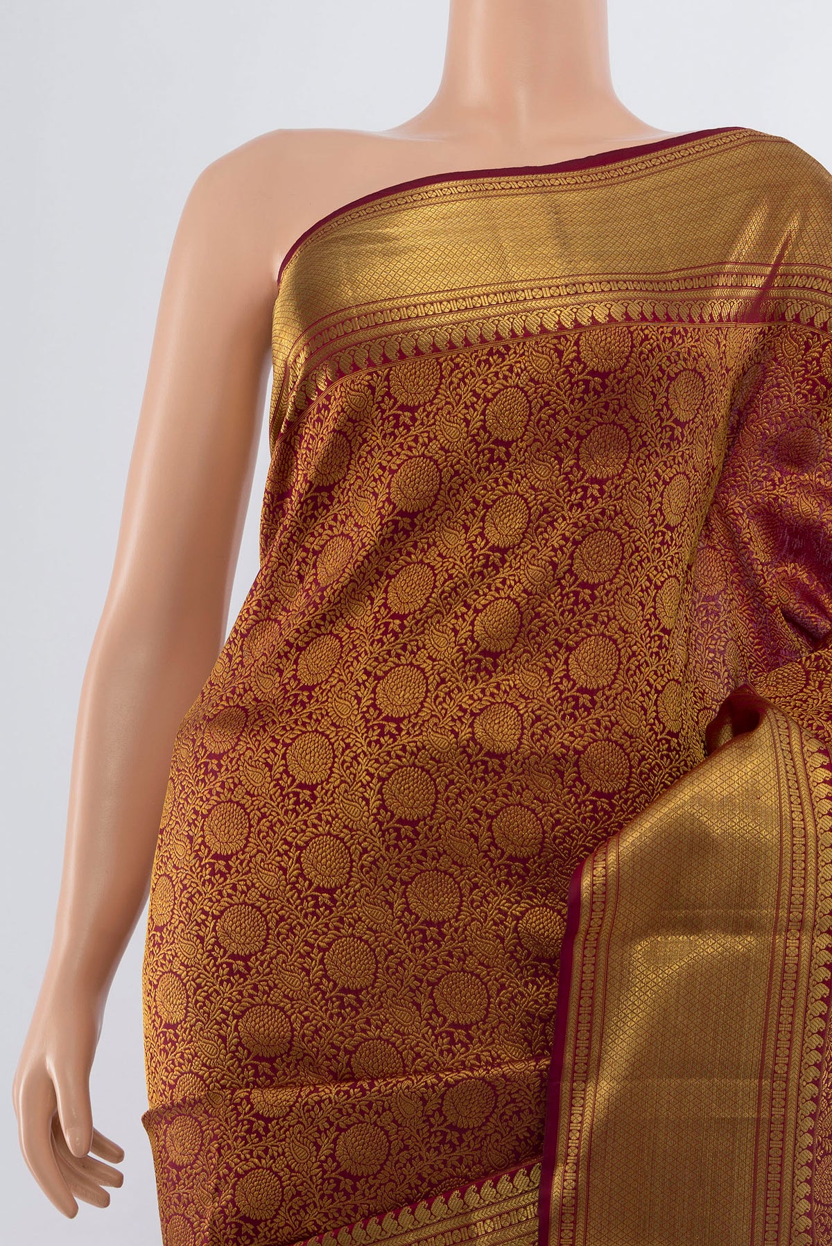 Border image of Maroon Kanchipuram Silk Saree with Zari Butta on the body and Silk Border. 