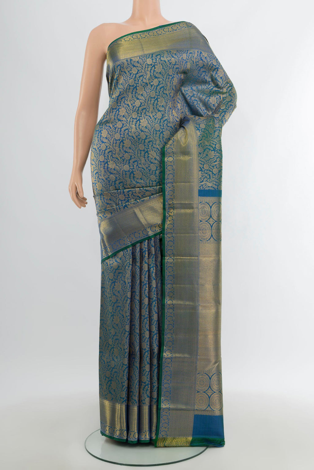 Peacock Blue Kanchipuram Silk Saree with Zari Brocade on the body and Zari Border.  displayed on a mannequin