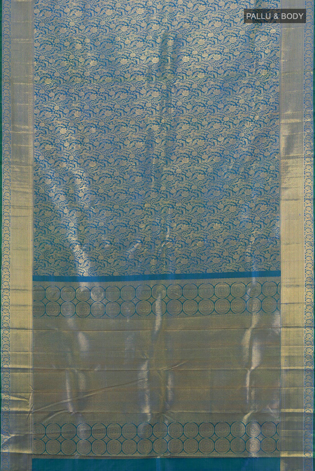 Flat view of Peacock Blue Kanchipuram Silk Saree with Zari Brocade on the body and Zari Border. 