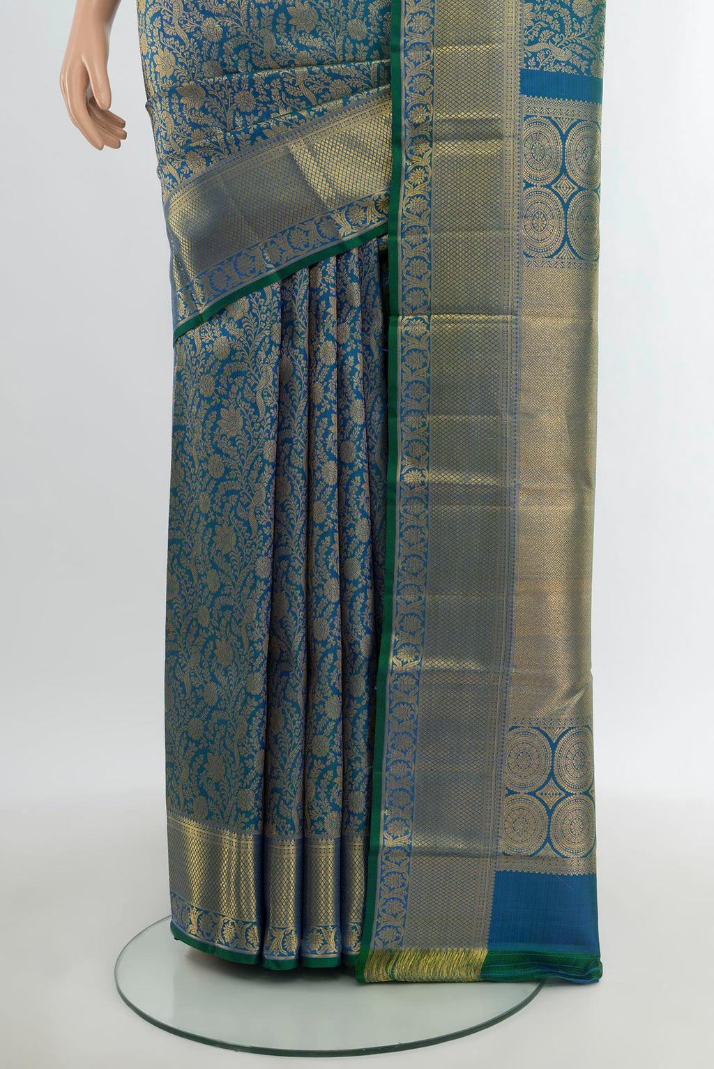 Pleats and pallu of Peacock Blue Kanchipuram Silk Saree with Zari Brocade on the body and Zari Border. 
