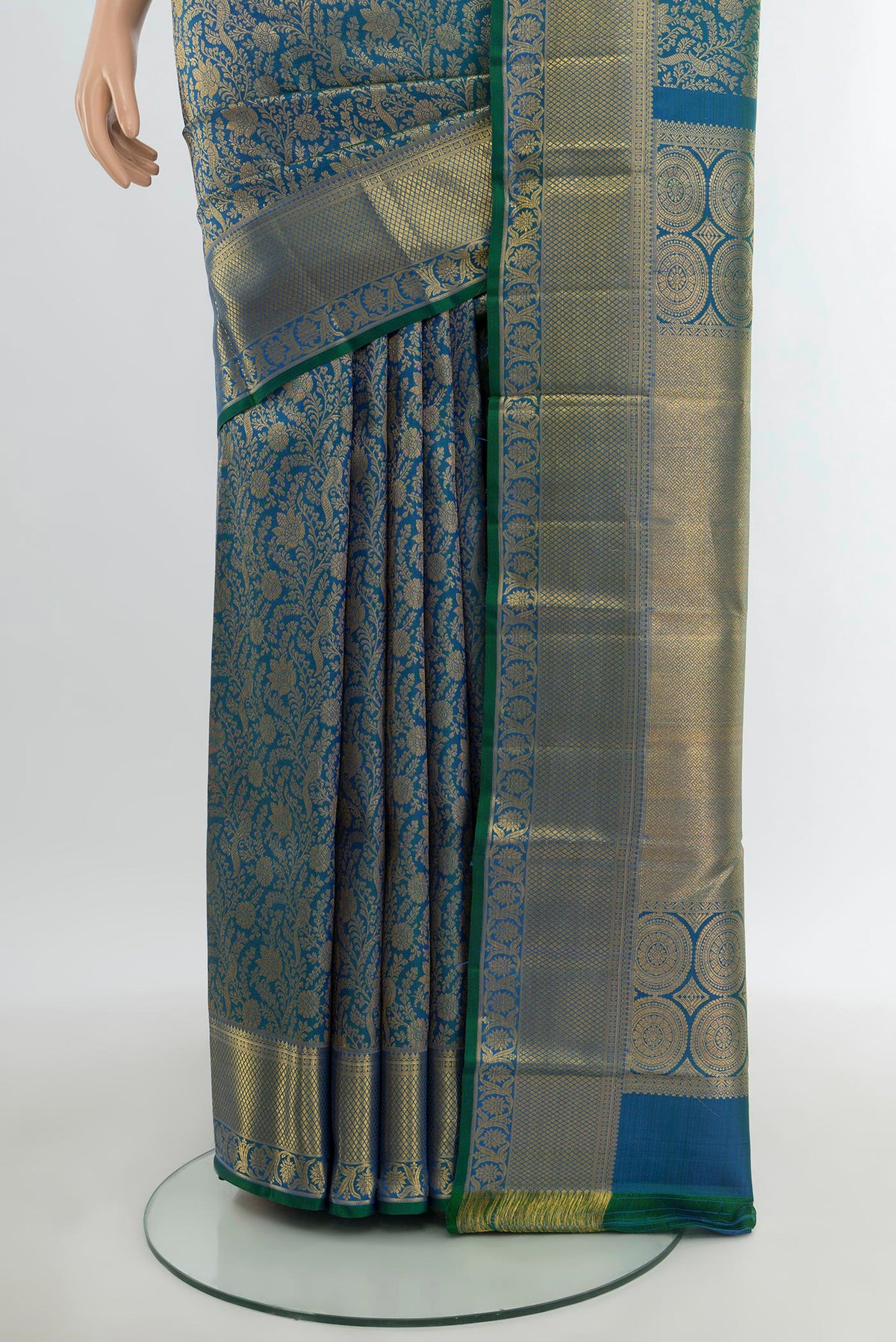 Pleats and pallu of Peacock Blue Kanchipuram Silk Saree with Zari Brocade on the body and Zari Border. 