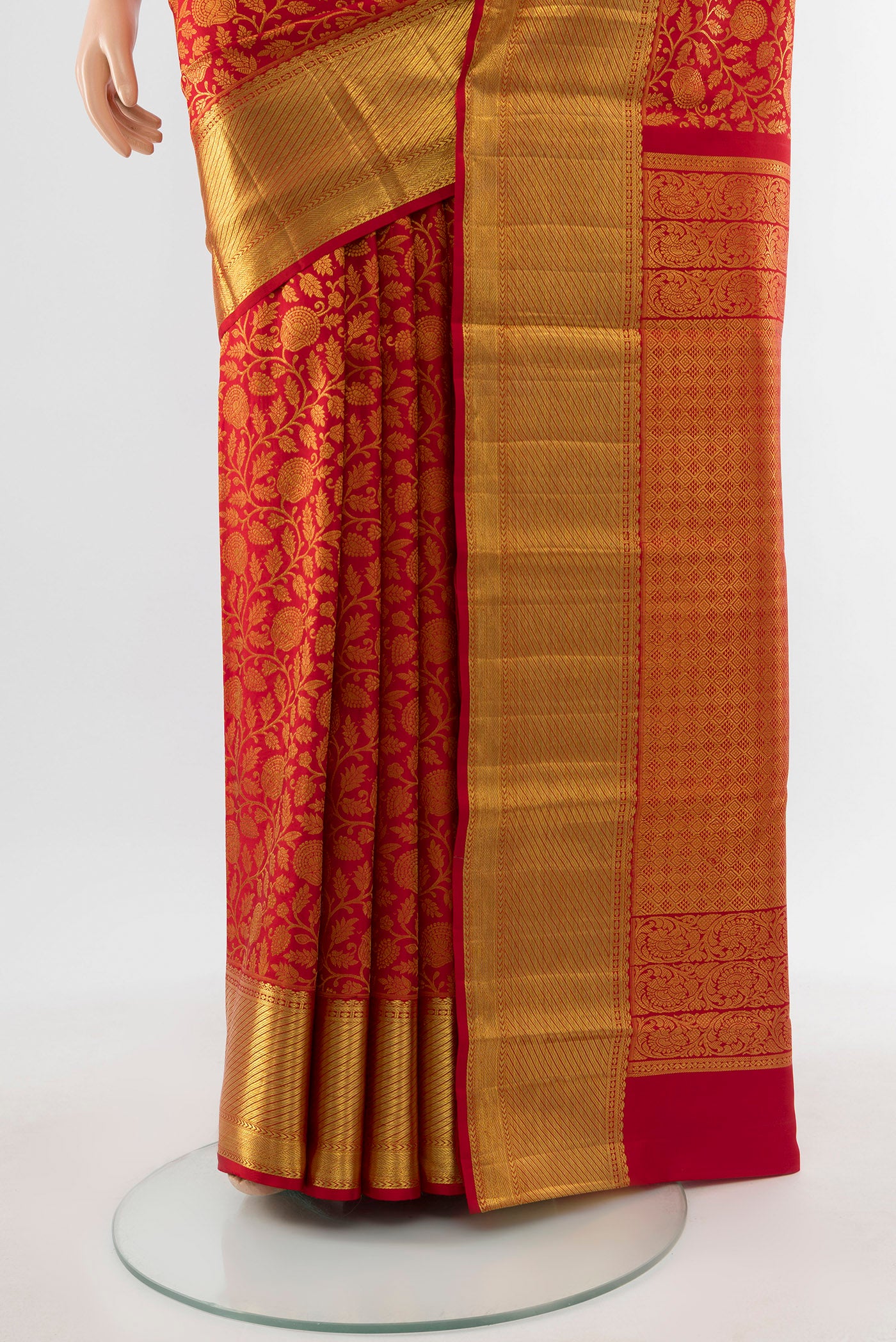 Pleats and pallu of Pure Silk Pure Zari Red Kanchipuram Saree with Zari Butta on the body and Silk Border. 
