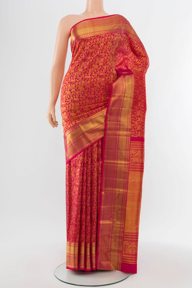 Golden Kanchipuram Silk Saree with Zari Butta on the body and Silk Border.  displayed on a mannequin