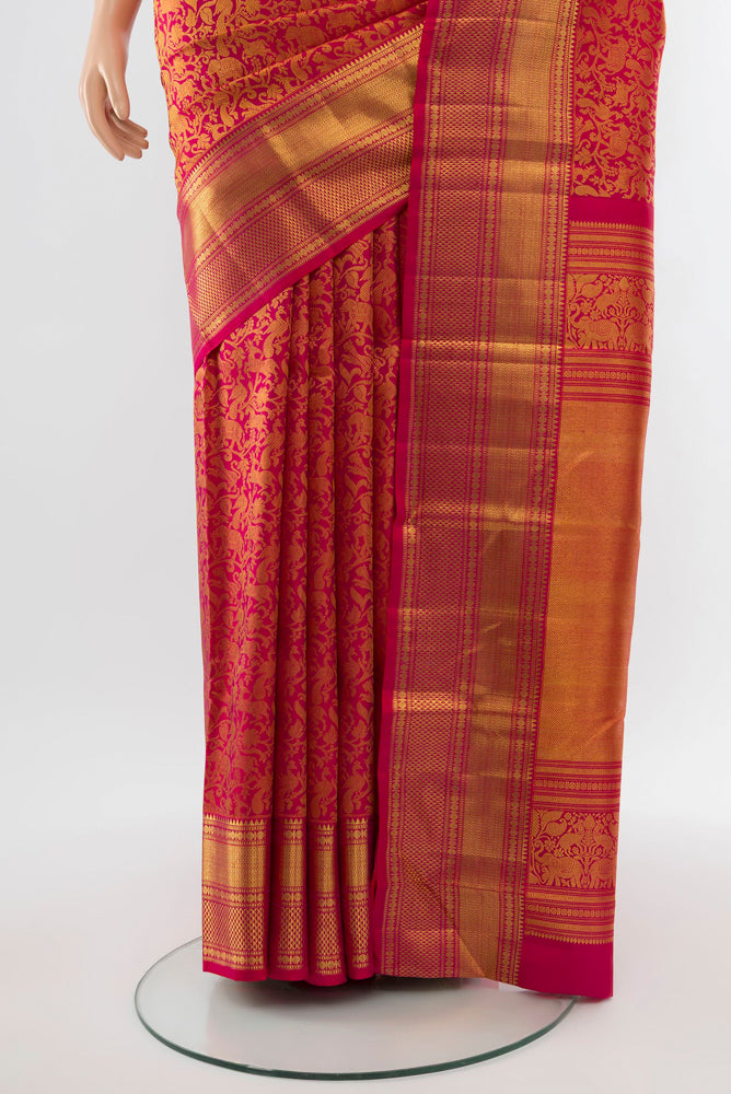 Pleats and pallu of Golden Kanchipuram Silk Saree with Zari Butta on the body and Silk Border. 