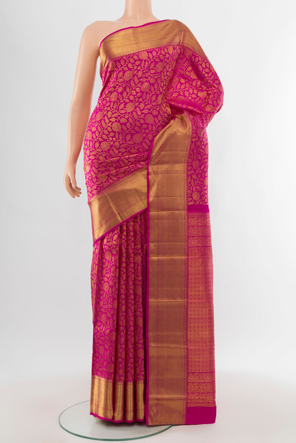 Pure Silk Pure Zari Magenta Kanchipuram Saree with Zari Butta on the body and Silk Border.  displayed on a mannequin