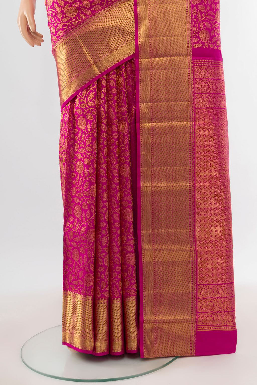 Pleats and pallu of Pure Silk Pure Zari Magenta Kanchipuram Saree with Zari Butta on the body and Silk Border. 