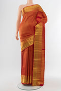 Golden Kanchipuram Silk Saree with Zari Butta on the body and Silk Border.  displayed on a mannequin