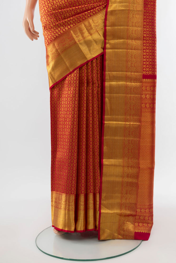 Pleats and pallu of Golden Kanchipuram Silk Saree with Zari Butta on the body and Silk Border. 