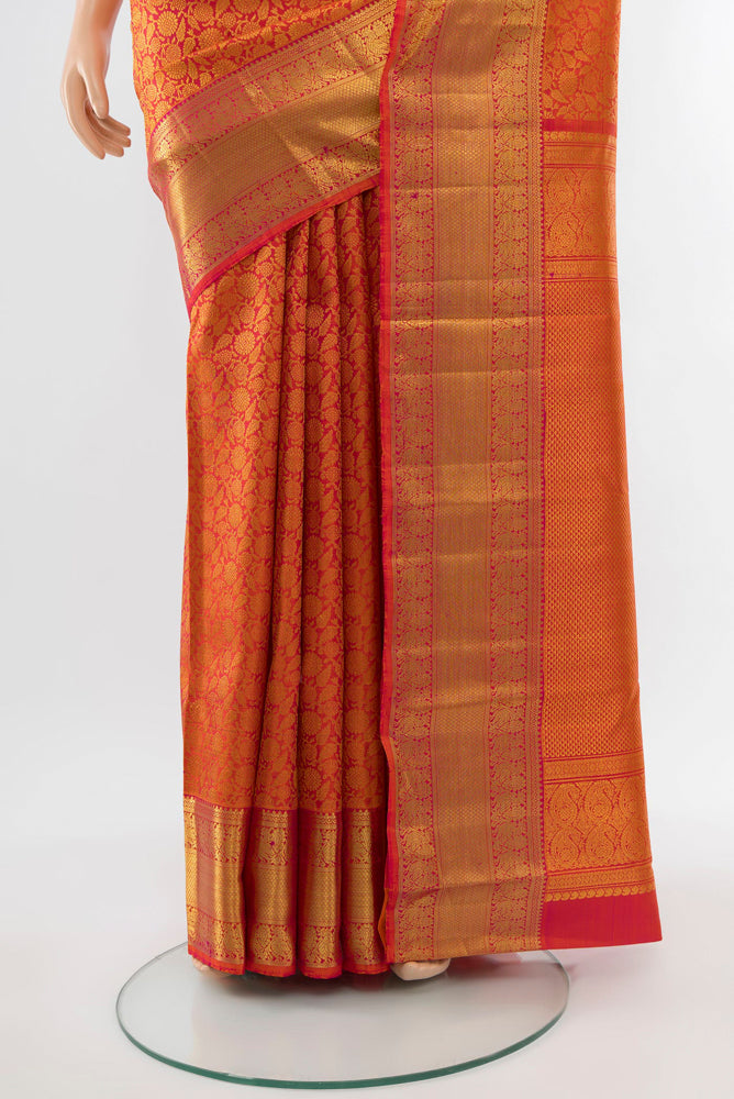 Pleats and pallu of Golden Peach Kanchipuram Silk Saree with Zari Butta on the body and Silk Border. 