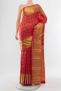 Golden Kanchipuram Silk Saree with Zari Butta on the body and Silk Border.  displayed on a mannequin