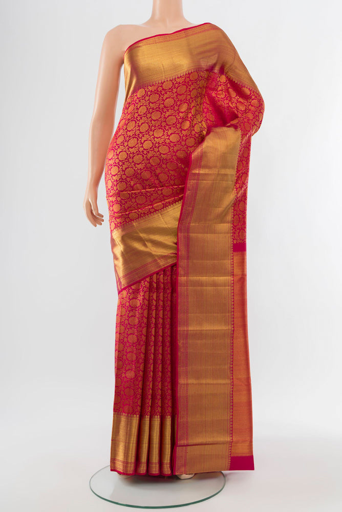 Golden Kanchipuram Silk Saree with Zari Butta on the body and Silk Border.  displayed on a mannequin
