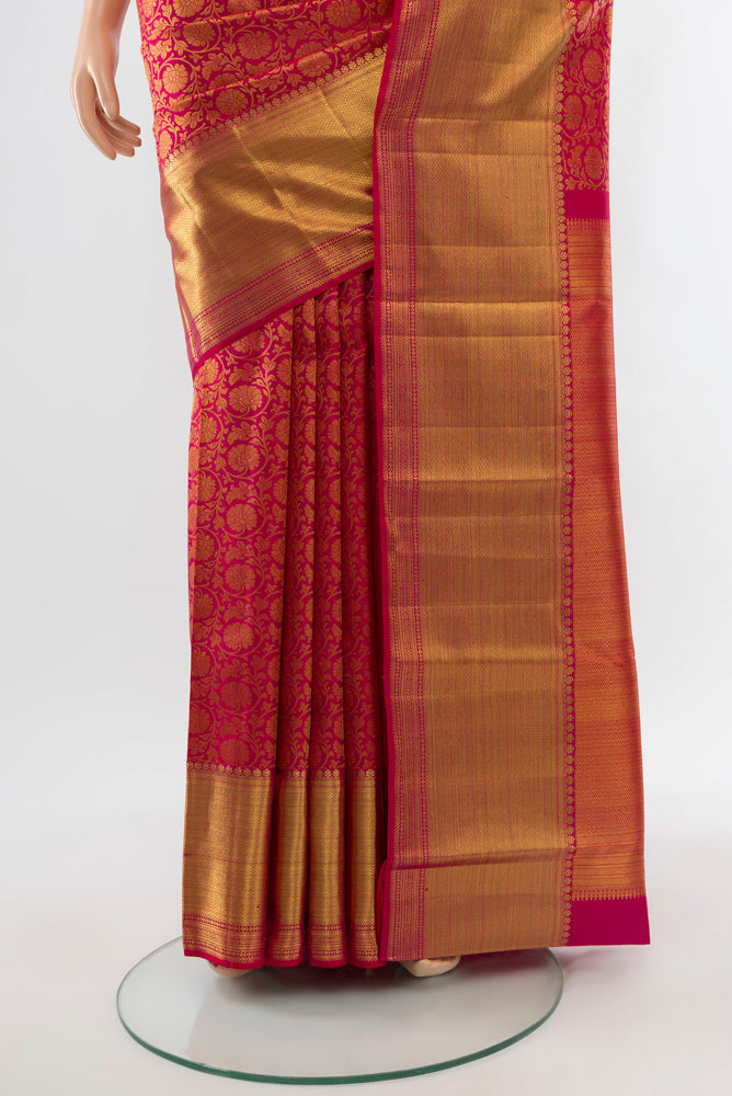 Pleats and pallu of Golden Kanchipuram Silk Saree with Zari Butta on the body and Silk Border. 