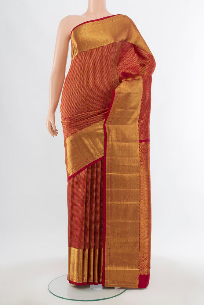 Maroon Kanchipuram Silk Saree with Zari Brocade on the body and Silk Border.  displayed on a mannequin