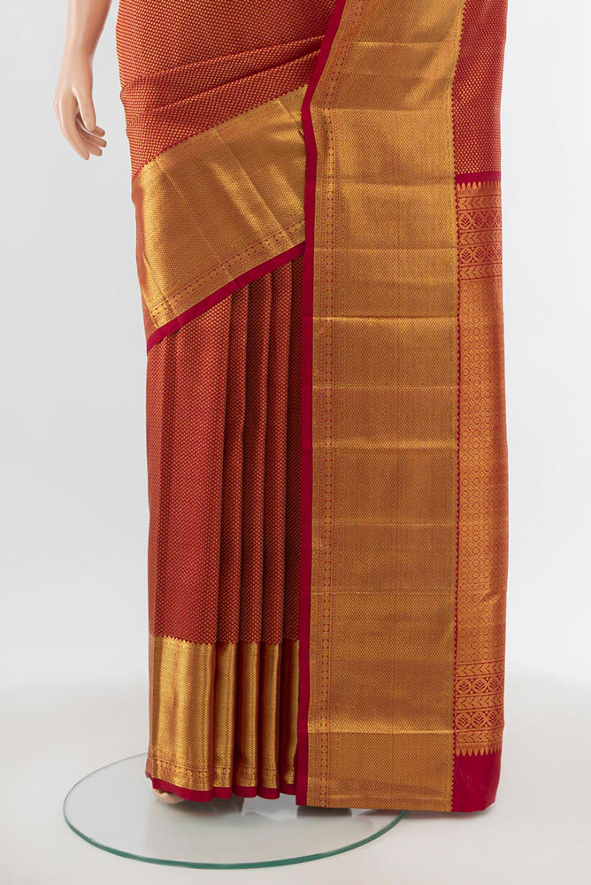 Pleats and pallu of Maroon Kanchipuram Silk Saree with Zari Brocade on the body and Silk Border. 