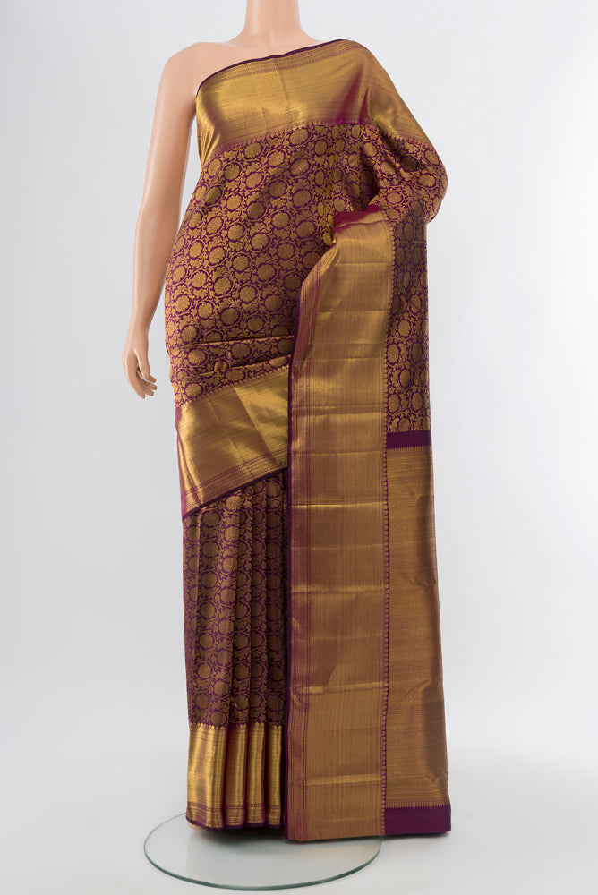 Purple Kanchipuram Silk Saree with Zari Butta on the body and Silk Border.  displayed on a mannequin