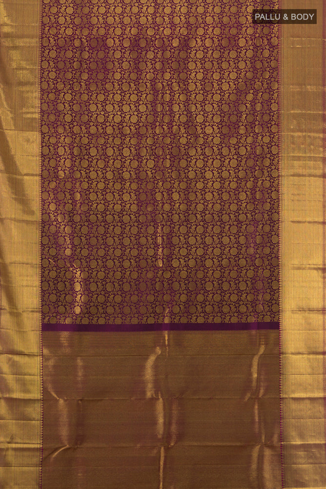 Flat view of Purple Kanchipuram Silk Saree with Zari Butta on the body and Silk Border. 