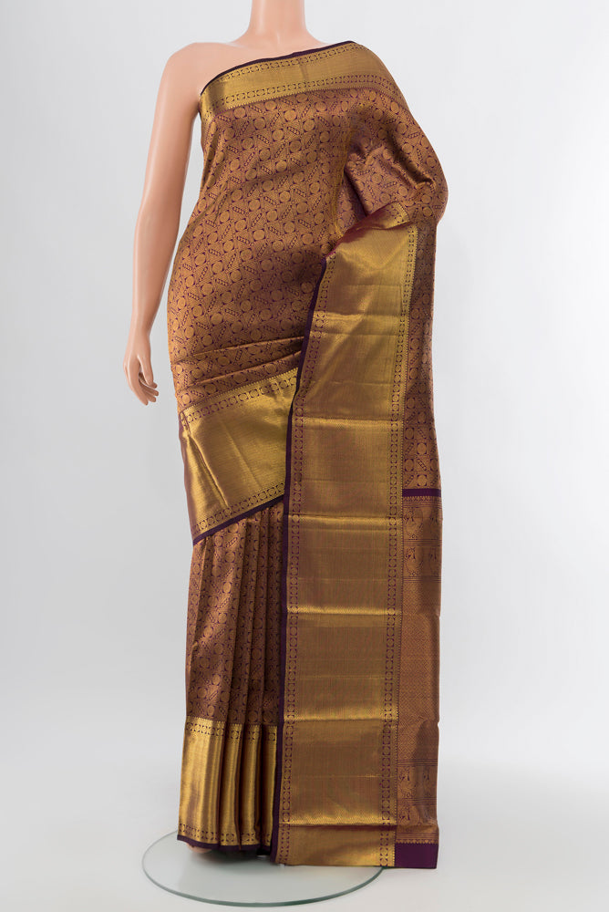 Violet Kanchipuram Silk Saree with Zari Butta on the body and Silk Border.  displayed on a mannequin