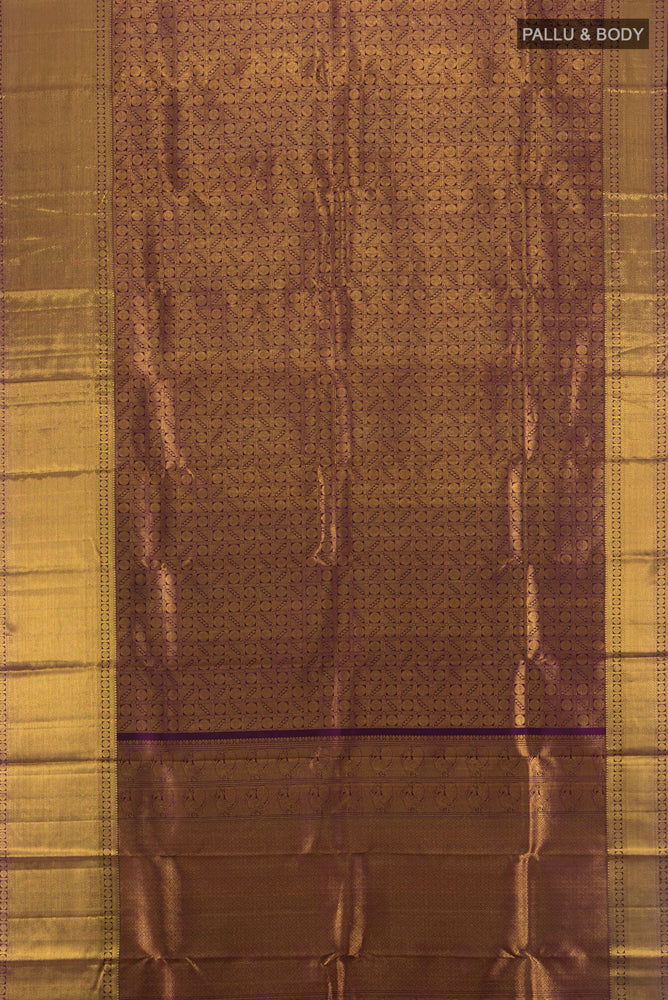 Flat view of Violet Kanchipuram Silk Saree with Zari Butta on the body and Silk Border. 
