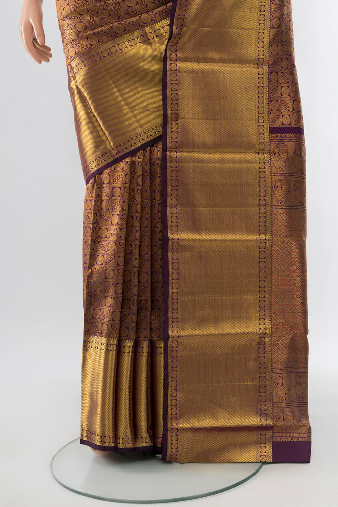 Pleats and pallu of Violet Kanchipuram Silk Saree with Zari Butta on the body and Silk Border. 