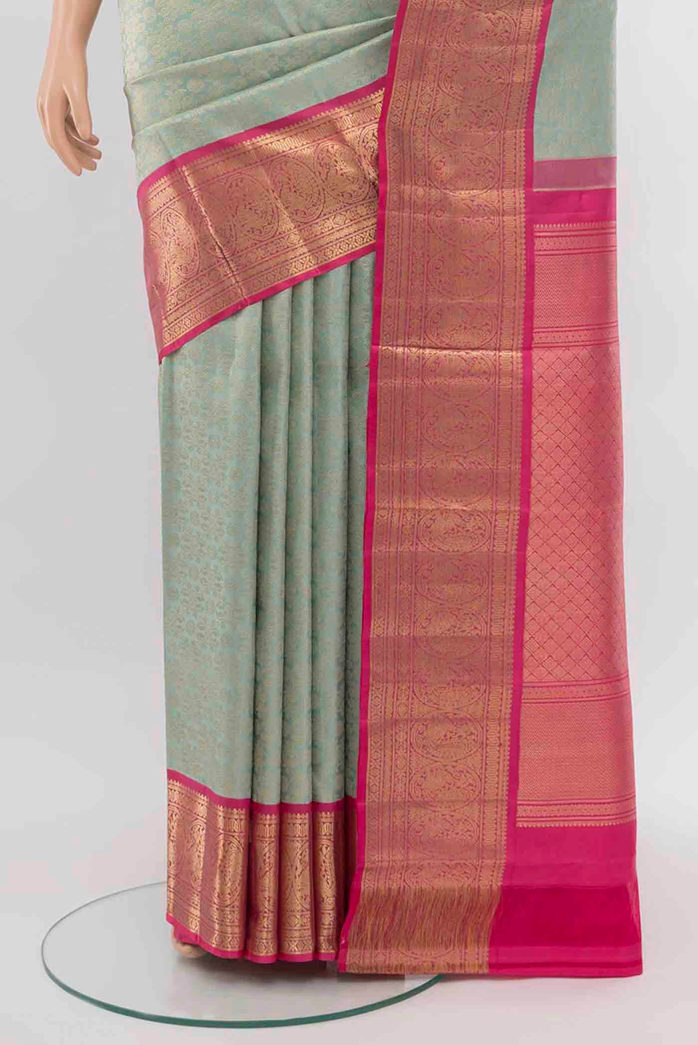 Pleats and pallu of Sky Blue Kanchipuram Silk Saree with Zari Butta on the body and Silk Border. 