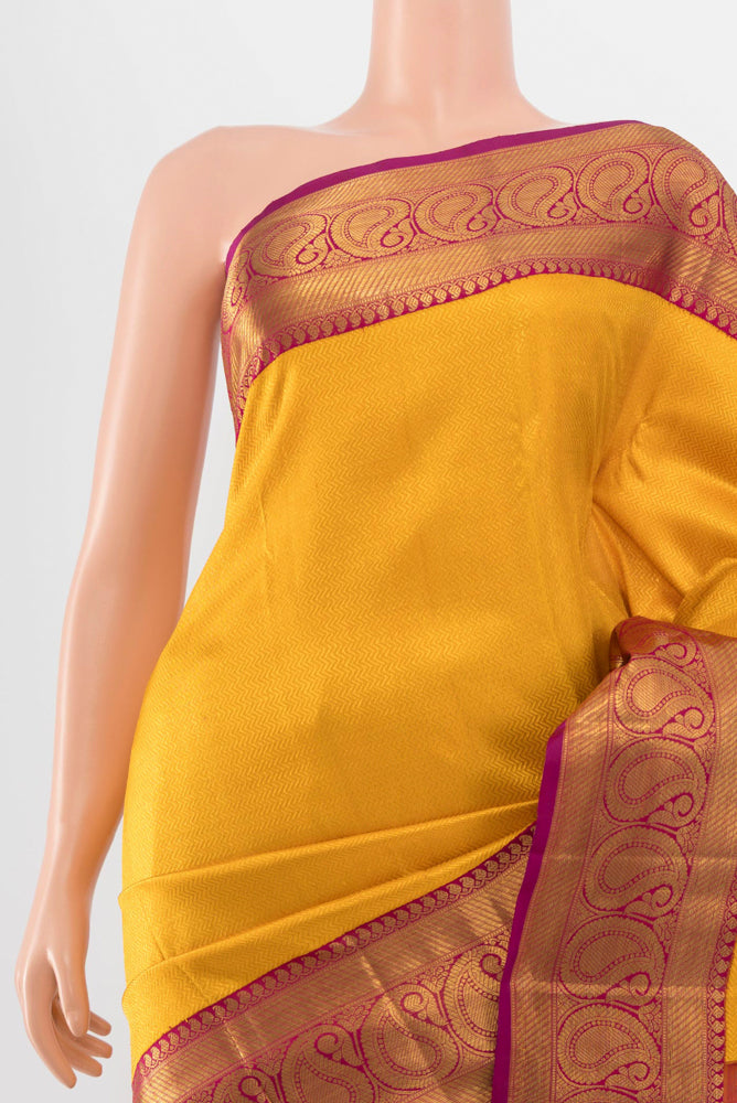Border image of Mustard Kanchipuram Silk Saree with Zari Butta on the body and Silk Border. 