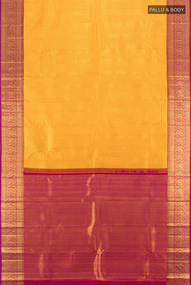 Flat view of Mustard Kanchipuram Silk Saree with Zari Butta on the body and Silk Border. 