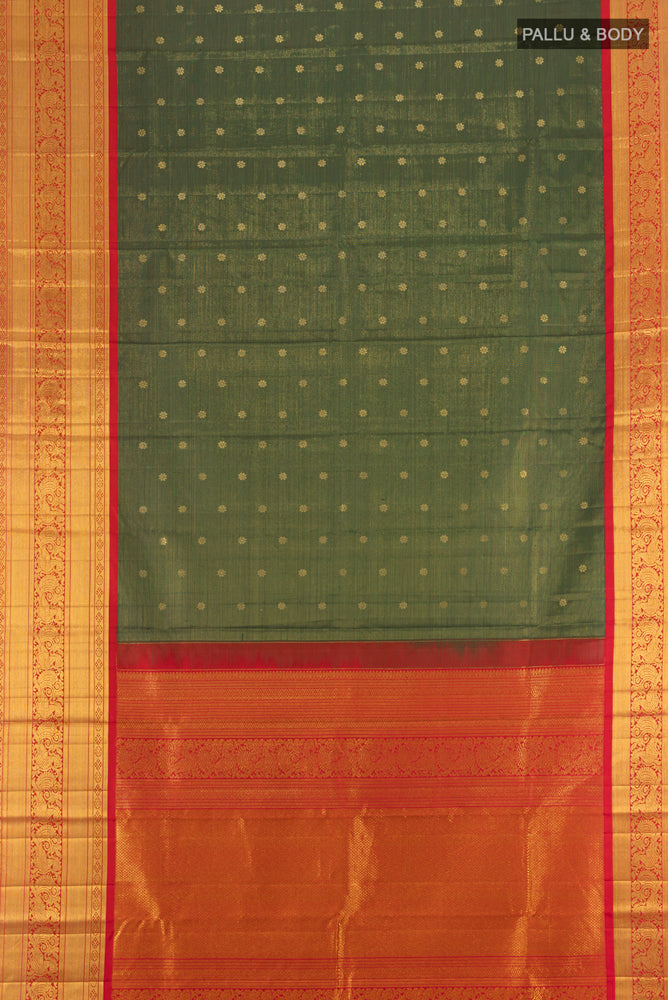Flat view of Bottle Green Kanjivaram Silk Saree with Zari Butta on the body and Silk Border. 