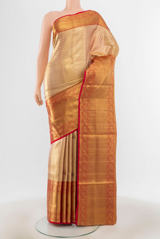 Pure Silk Pure Zari Golden Kanjivaram Saree with Zari Butta on the body and Silk Border.  displayed on a mannequin