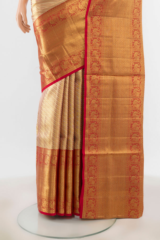 Pleats and pallu of Pure Silk Pure Zari Golden Kanjivaram Saree with Zari Butta on the body and Silk Border. 