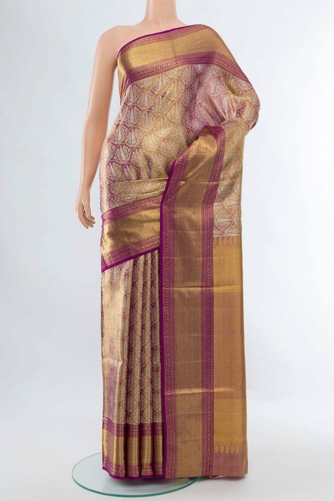 Golden Kanjivaram Silk Saree with Zari Butta on the body and Silk Border.  displayed on a mannequin