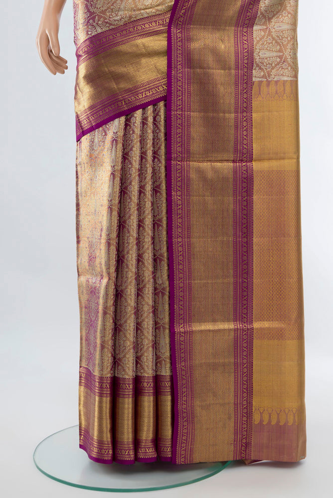 Pleats and pallu of Golden Kanjivaram Silk Saree with Zari Butta on the body and Silk Border. 